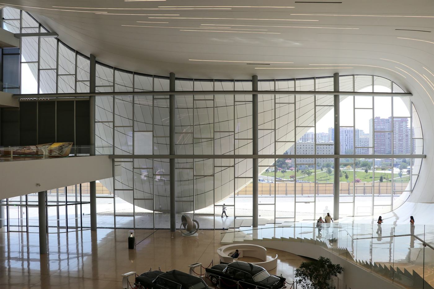 Northpoint Office: a curved white atrium with a wall of glass overlooking a city